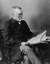 photo of Carnegie reading a newspaper